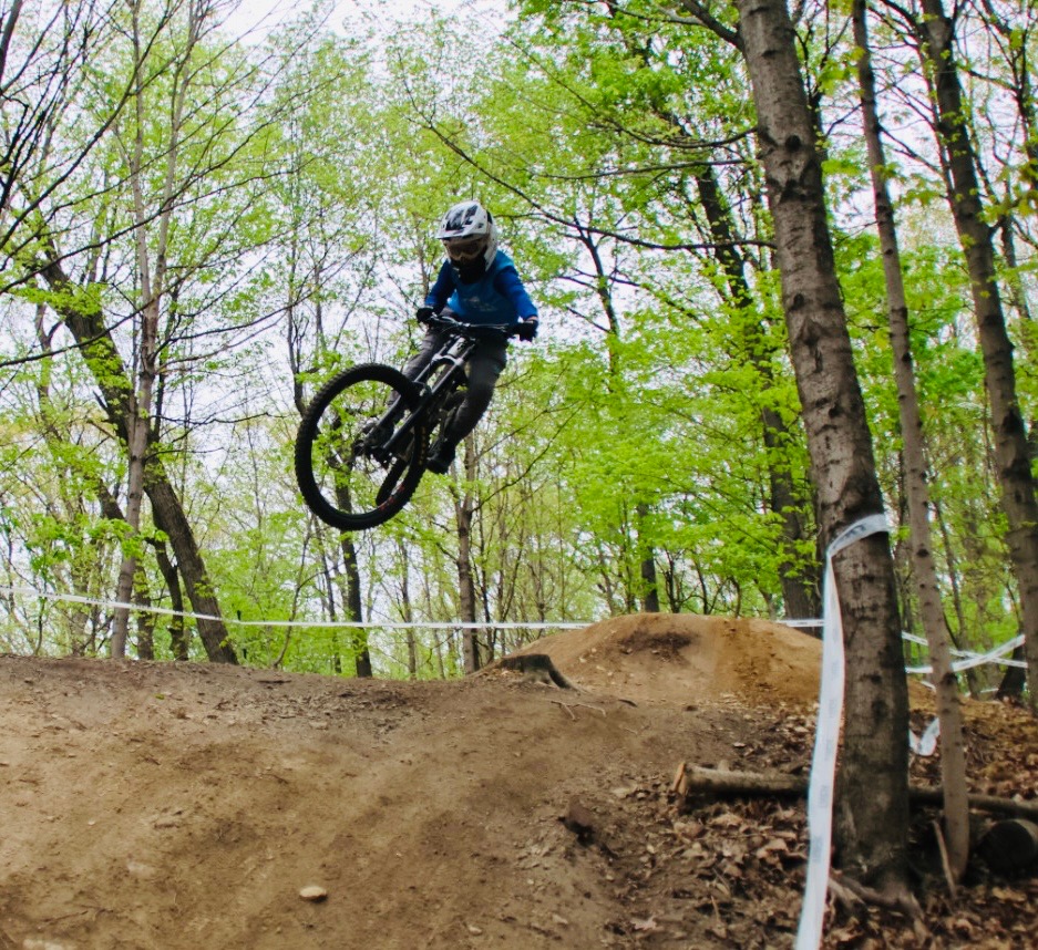 Marshall Fisher jumping his bike during a downhill race