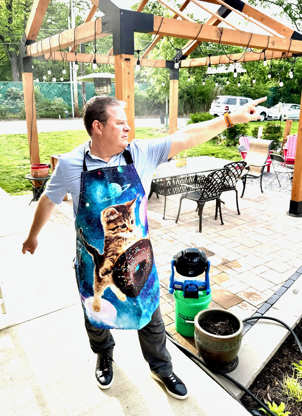 Nate Fisher pointing while wearing a space cat apron